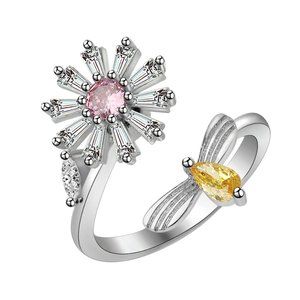Silver ring with CZ Daisy, has pink center stone and topaz accent.